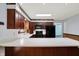 Kitchen featuring dark wood cabinets, modern appliances, and a large white countertop island at 6958 W Brier Creek Dr, New Palestine, IN 46163
