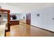 Spacious living room connects kitchen and features wood floors throughout at 6958 W Brier Creek Dr, New Palestine, IN 46163