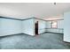 Spacious living room featuring comfortable carpet, and natural light at 6958 W Brier Creek Dr, New Palestine, IN 46163