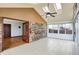 Enclosed sun room featuring a brick wall, skylights and light tile flooring at 6958 W Brier Creek Dr, New Palestine, IN 46163