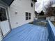 White home with blue deck, white trim and dark windows at 7130 English Birch Ln, Indianapolis, IN 46268