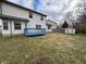 Large backyard with blue deck, table, storage shed, and exterior of home at 7130 English Birch Ln, Indianapolis, IN 46268