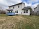Large backyard with blue deck, table, and exterior of home at 7130 English Birch Ln, Indianapolis, IN 46268