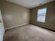 Bedroom with neutral carpet and walls with a window allowing ample natural light at 7130 English Birch Ln, Indianapolis, IN 46268