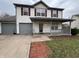 Charming two-story home featuring red shutters, a covered porch, and a convenient attached garage at 7130 English Birch Ln, Indianapolis, IN 46268