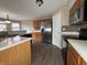 Functional kitchen with stainless steel appliances, ample counter space, and a breakfast bar for casual dining at 7130 English Birch Ln, Indianapolis, IN 46268