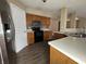 Well-equipped kitchen with modern appliances, light wood cabinets, and plenty of counter space at 7130 English Birch Ln, Indianapolis, IN 46268
