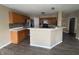 Open kitchen with bar-style seating, light wood cabinets, and stainless steel appliances perfect for cooking and entertaining at 7130 English Birch Ln, Indianapolis, IN 46268