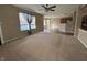 Open concept living room shows seamless flow into kitchen area with breakfast bar at 7130 English Birch Ln, Indianapolis, IN 46268