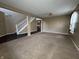 Spacious living room featuring neutral paint, carpeted floors, and ample natural light at 7130 English Birch Ln, Indianapolis, IN 46268