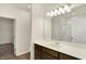 Bathroom boasting a large mirror, double vanity with dark wood cabinets, and a shower at 7170 Rose Hill Ave, Brownsburg, IN 46112