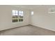 Bedroom with neutral carpet and multiple windows allowing lots of natural light into the room at 7170 Rose Hill Ave, Brownsburg, IN 46112