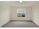 Bedroom with a large window providing ample light and an exterior view at 7170 Rose Hill Ave, Brownsburg, IN 46112