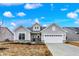 Charming single Gathering home with stone accents, a two-car garage and impeccable curb appeal at 7170 Rose Hill Ave, Brownsburg, IN 46112