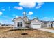 Craftsman-style home with a well-manicured lawn, attached two car garage, and inviting front porch at 7170 Rose Hill Ave, Brownsburg, IN 46112