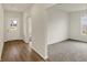 Welcoming hallway with wood floors, a door to the outside, and a view into another room at 7170 Rose Hill Ave, Brownsburg, IN 46112