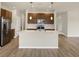 Modern kitchen featuring a kitchen island, stainless steel appliances, and ample cabinet space at 7170 Rose Hill Ave, Brownsburg, IN 46112