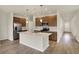 Stylish kitchen with a large island, stainless steel appliances, and easy access to the hallway and backyard at 7170 Rose Hill Ave, Brownsburg, IN 46112
