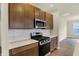 Close up of modern kitchen with stainless steel appliances and stylish cabinetry at 7170 Rose Hill Ave, Brownsburg, IN 46112