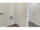 Laundry area featuring washer and dryer hookups, white walls, and wood-look flooring at 7170 Rose Hill Ave, Brownsburg, IN 46112