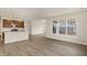 Open-concept living room features a modern kitchen, hardwood floors, and lots of natural light at 7170 Rose Hill Ave, Brownsburg, IN 46112