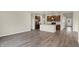 Spacious open-concept home with a modern kitchen, stainless appliances, and gorgeous hardwood floors at 7170 Rose Hill Ave, Brownsburg, IN 46112