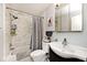 This bathroom features a vanity, mirror, toilet, and shower with curtain and showerhead at 7347 Blue Creek S Dr, Indianapolis, IN 46256