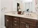 Modern bathroom vanity with double sinks, ample lighting, and quartz countertop at 7347 Blue Creek S Dr, Indianapolis, IN 46256