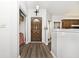 The foyer features wood floors and a clear view to the Kitchen at 7347 Blue Creek S Dr, Indianapolis, IN 46256
