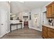 Hallway with modern console table, neutral walls, and hardwood flooring at 7347 Blue Creek S Dr, Indianapolis, IN 46256