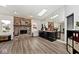 Open living room boasts a brick fireplace, skylights, and lots of natural light at 7347 Blue Creek S Dr, Indianapolis, IN 46256