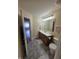 Bright bathroom with updated vanity, gray tile flooring, and a well-lit mirror at 8160 Shores Edge Way, Indianapolis, IN 46237