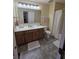 Well-lit bathroom features a large vanity, ample storage, and shower at 8160 Shores Edge Way, Indianapolis, IN 46237