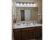 Bathroom with white countertop and decorative wood cabinets at 8160 Shores Edge Way, Indianapolis, IN 46237
