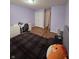 Bedroom with wood floors and double-door closet at 8160 Shores Edge Way, Indianapolis, IN 46237