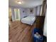 Bedroom with wood floors, large bed, and an ensuite bathroom view at 8160 Shores Edge Way, Indianapolis, IN 46237