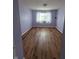 Well-lit bedroom featuring hardwood floors, natural light, and neutral paint at 8160 Shores Edge Way, Indianapolis, IN 46237