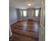 Bright bedroom featuring hardwood floors, natural light, and neutral paint at 8160 Shores Edge Way, Indianapolis, IN 46237