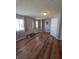 Cozy bedroom featuring hardwood floors, natural light, and neutral paint at 8160 Shores Edge Way, Indianapolis, IN 46237