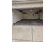 Spacious garage with concrete floor, overhead lighting, and storage shelving at 8160 Shores Edge Way, Indianapolis, IN 46237