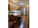 Functional kitchen with stainless steel appliances, white countertops, and wood cabinets at 8160 Shores Edge Way, Indianapolis, IN 46237