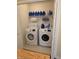 Neat laundry room featuring a new washer and dryer and shelving for storage at 8160 Shores Edge Way, Indianapolis, IN 46237