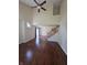 Open-concept living space with hardwood floors, staircase, and plenty of natural light at 8160 Shores Edge Way, Indianapolis, IN 46237