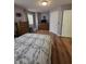 Comfortable bedroom with wood floors, a large bed, and neutral decor at 8160 Shores Edge Way, Indianapolis, IN 46237