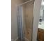 Bathroom shower stall with white and blue patterned curtain at 8160 Shores Edge Way, Indianapolis, IN 46237