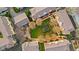 Aerial view of townhomes showcasing a central green courtyard and mature trees at 907 Junction Pl # 41907, Indianapolis, IN 46220