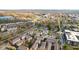Overhead captures the neighborhood's colorful buildings, serene pond, lush greenery and river views at 907 Junction Pl # 41907, Indianapolis, IN 46220