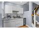 Wet bar with gray cabinets, wine cooler, and beverage refrigerator located near staircase at 907 Junction Pl # 41907, Indianapolis, IN 46220
