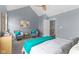 Bedroom featuring vaulted ceiling, ceiling fan, grey walls, carpet, and two sitting chairs at 907 Junction Pl # 41907, Indianapolis, IN 46220