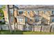 Well-maintained townhouse exterior with stairs leading to the front door and ample windows at 907 Junction Pl # 41907, Indianapolis, IN 46220